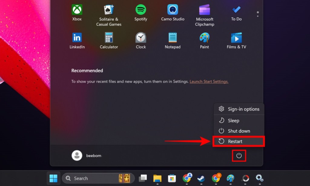 para reiniciar la PC en Windows 11, haga clic en el botón de Windows en la barra de tareas, luego en el botón de encendido y luego haga clic en el botón Reiniciar