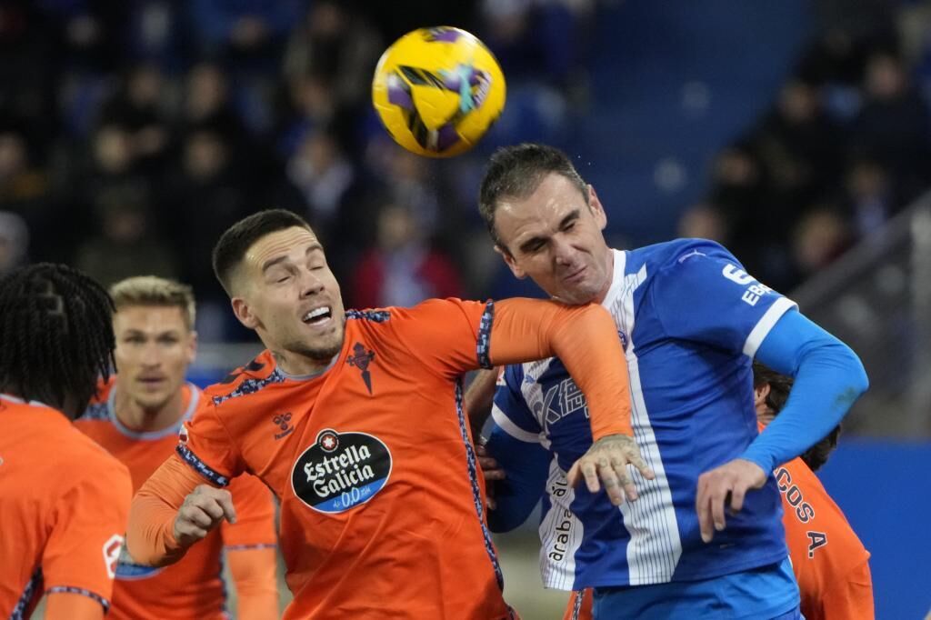 Kike Garcia challenges for a header