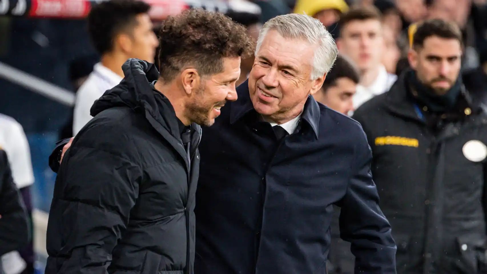 Ancelotti jokes with Simeone.